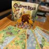 A game setup with reversible tiles fanned out on a table.