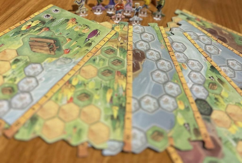 A game setup with reversible tiles fanned out on a table.
